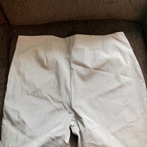 Black and white pinstripe stretch pants. Tailored at the bottom.